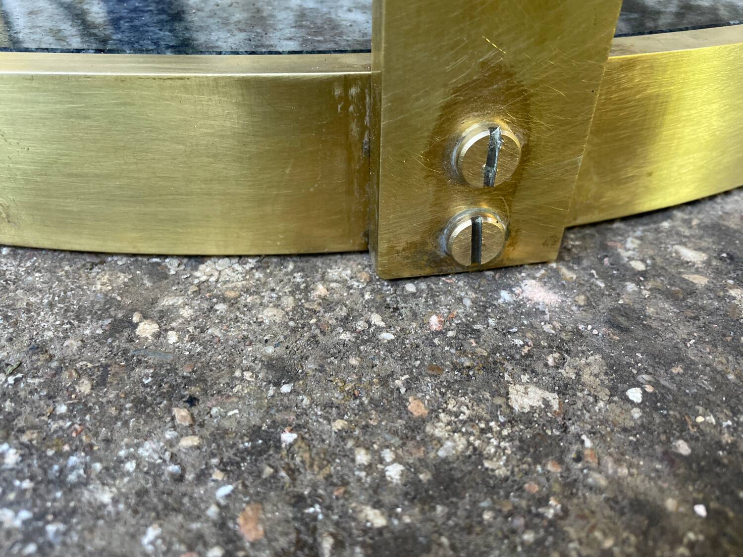 Round dining table with green marble and solid brass.