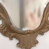 Bakelite scrolled mirror with rocaille pediment