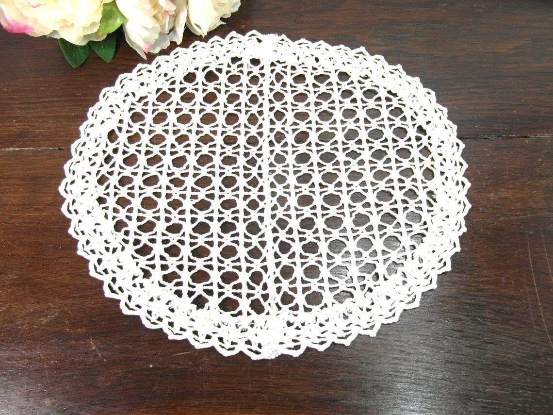 Handmade oval placemat in crocheted cotton lace