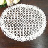 Handmade oval placemat in crocheted cotton lace