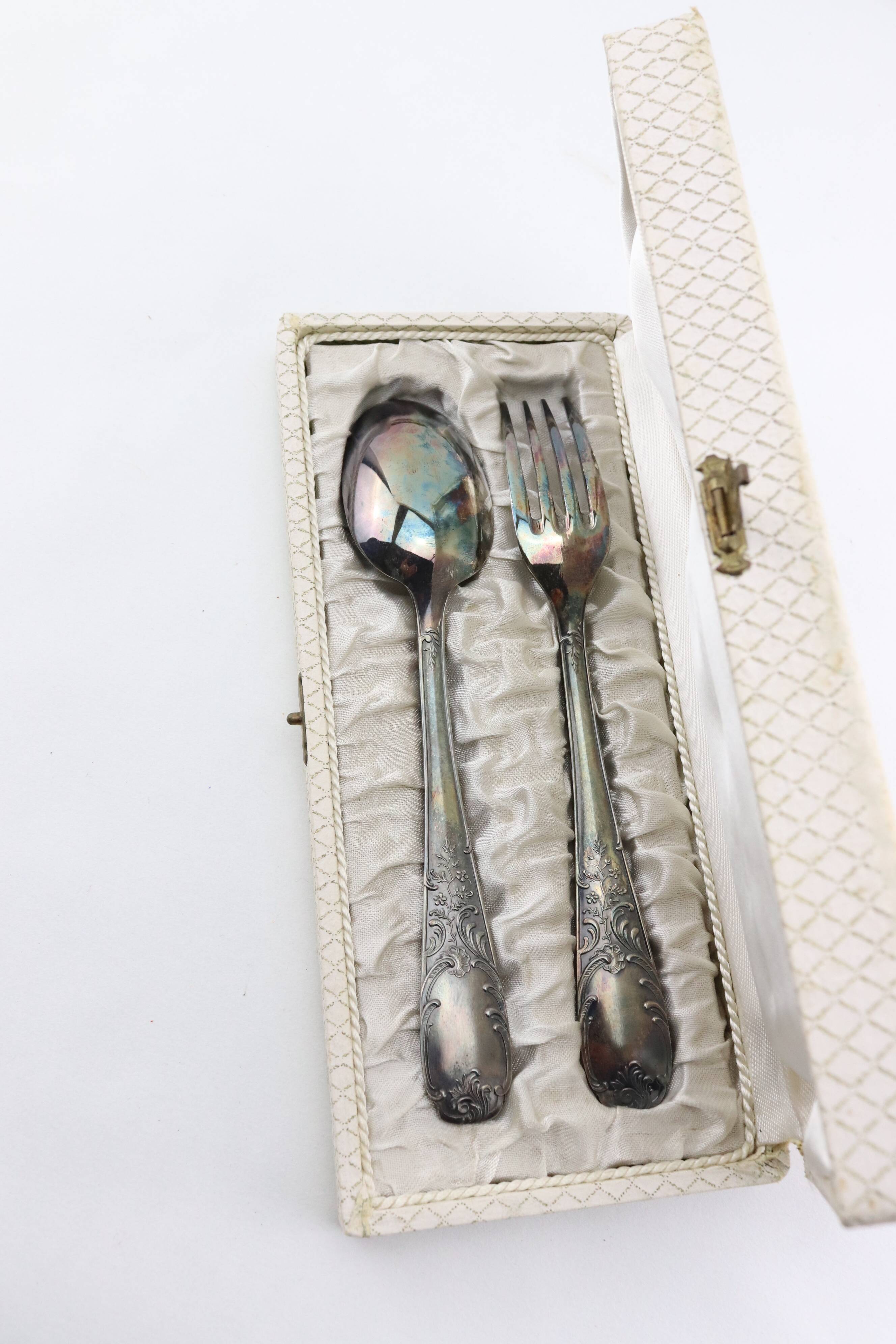 Old covered box in silver or silver metal spoon and fork with hallmarks