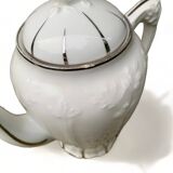 Porcelain coffee pot with floral pattern and silver stem