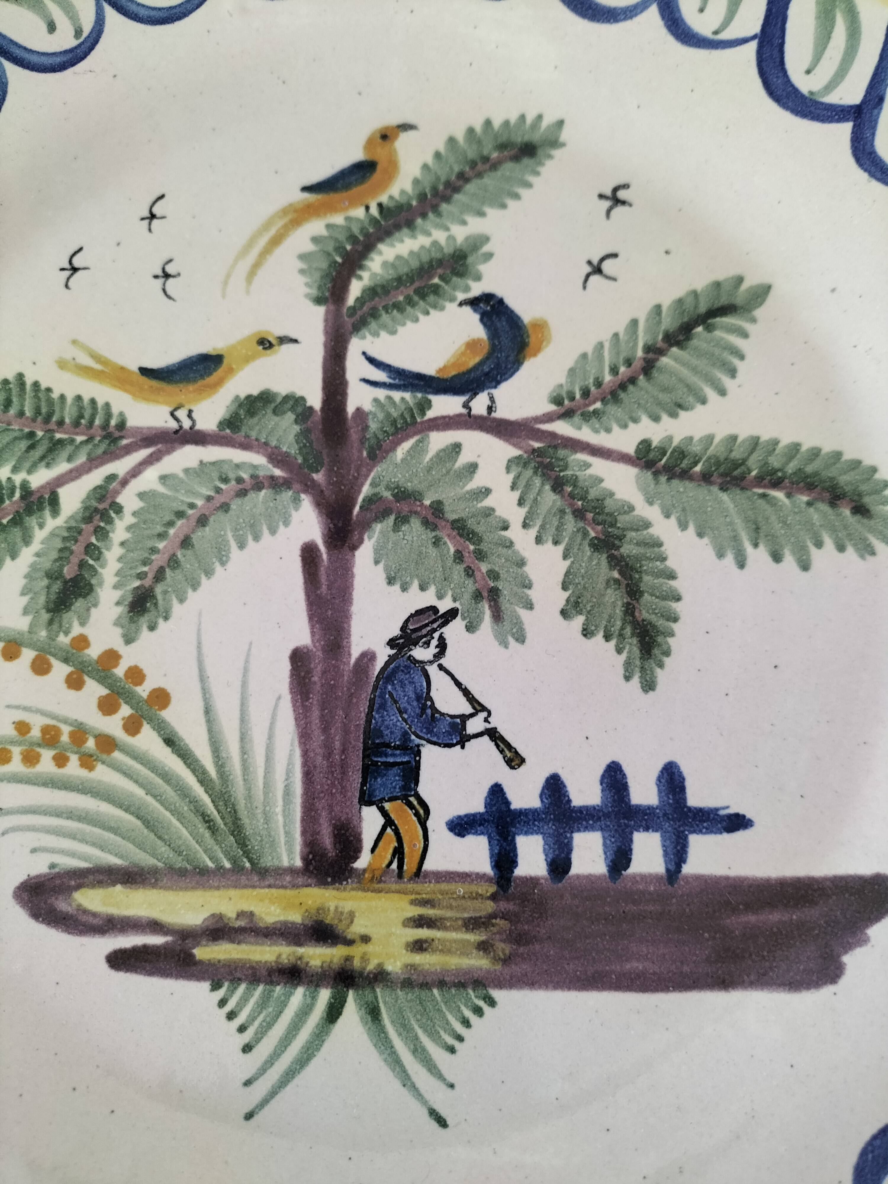 Antique hand-painted earthenware plate – piper and birds