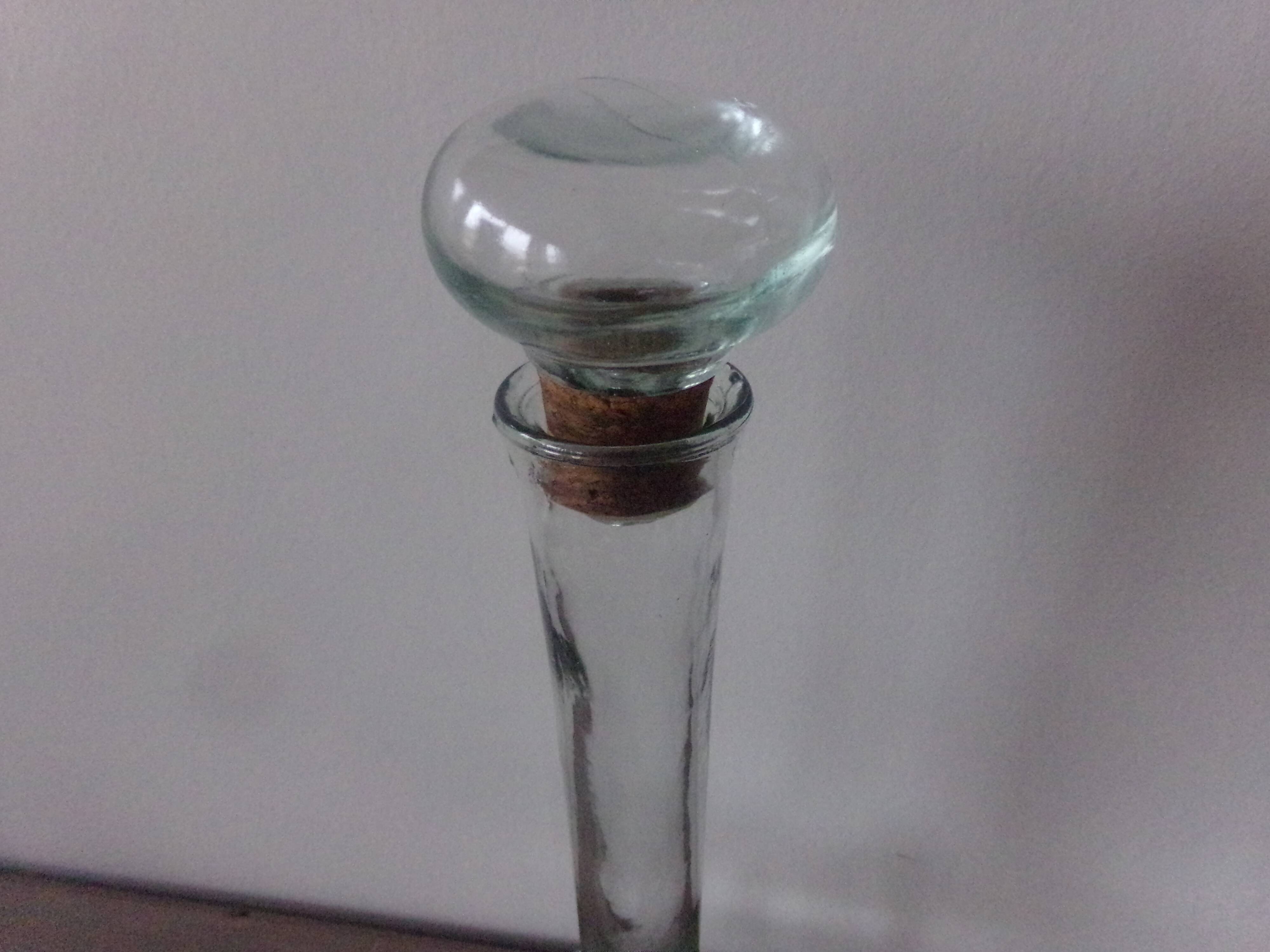 Glass bottle with its cap