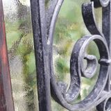 Porte d’entrée vitrée en chêne et grilles en fer, XIXème s.