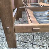 Pair of solid wood and leather lounge chairs, European work, circa 1970.