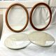 Pair of oval wooden frames with gilding