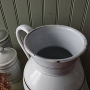 Rare large, pot-bellied toilet jug in white enamelled sheet metal with gold edging