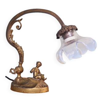 Gilded bronze lamp with cherub and opalescent glass bobbin