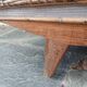 Vintage woven rattan furniture with tapered legs.
