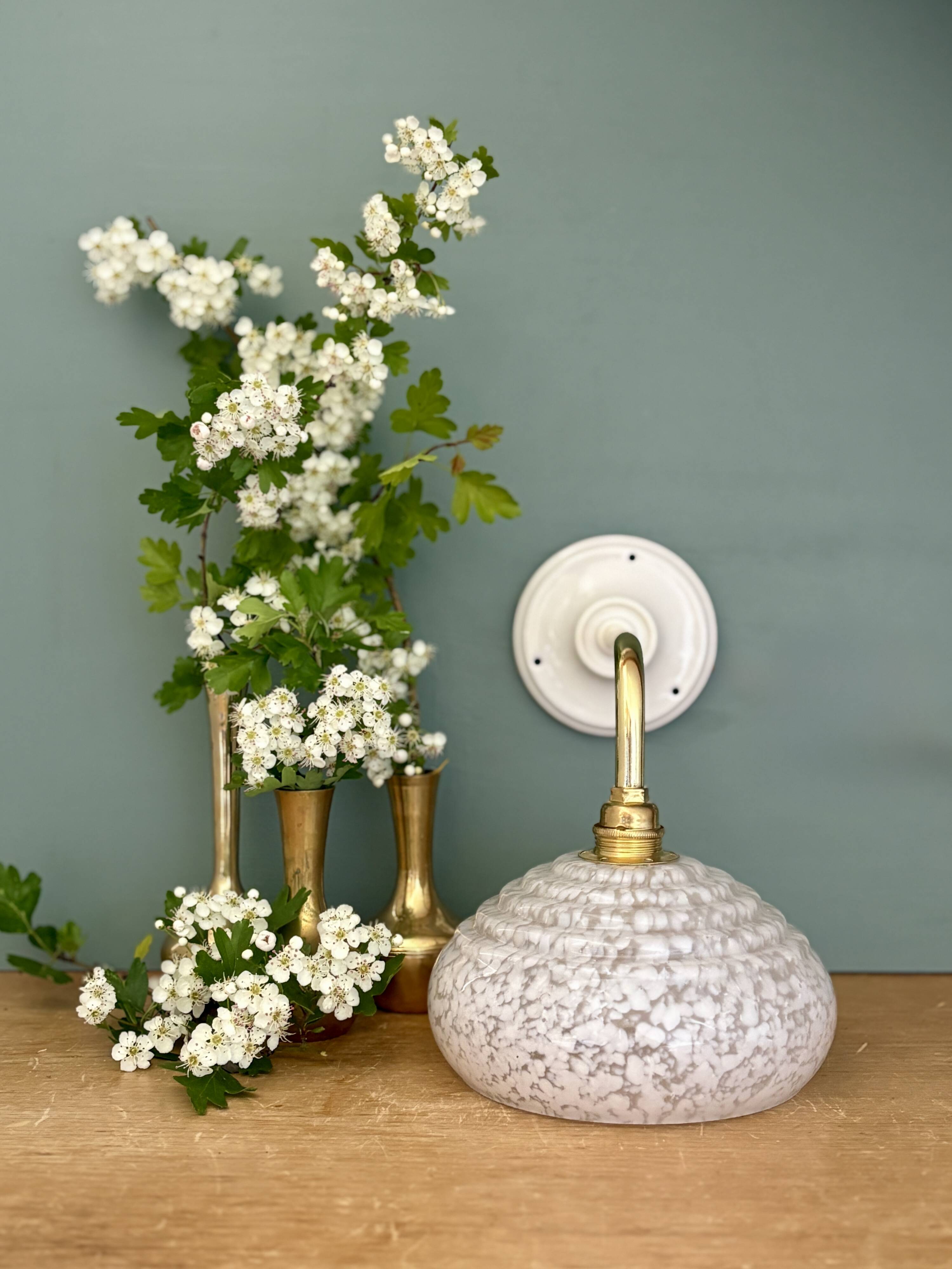 Vintage glass wall lamp with a white Clichy shade.