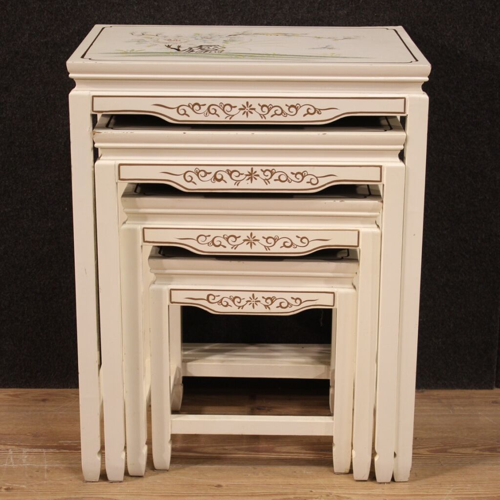 Four lacquered and painted living room coffee tables