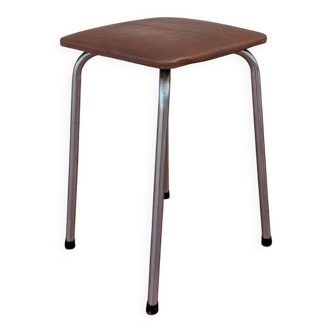 Stool covered in faux leather.