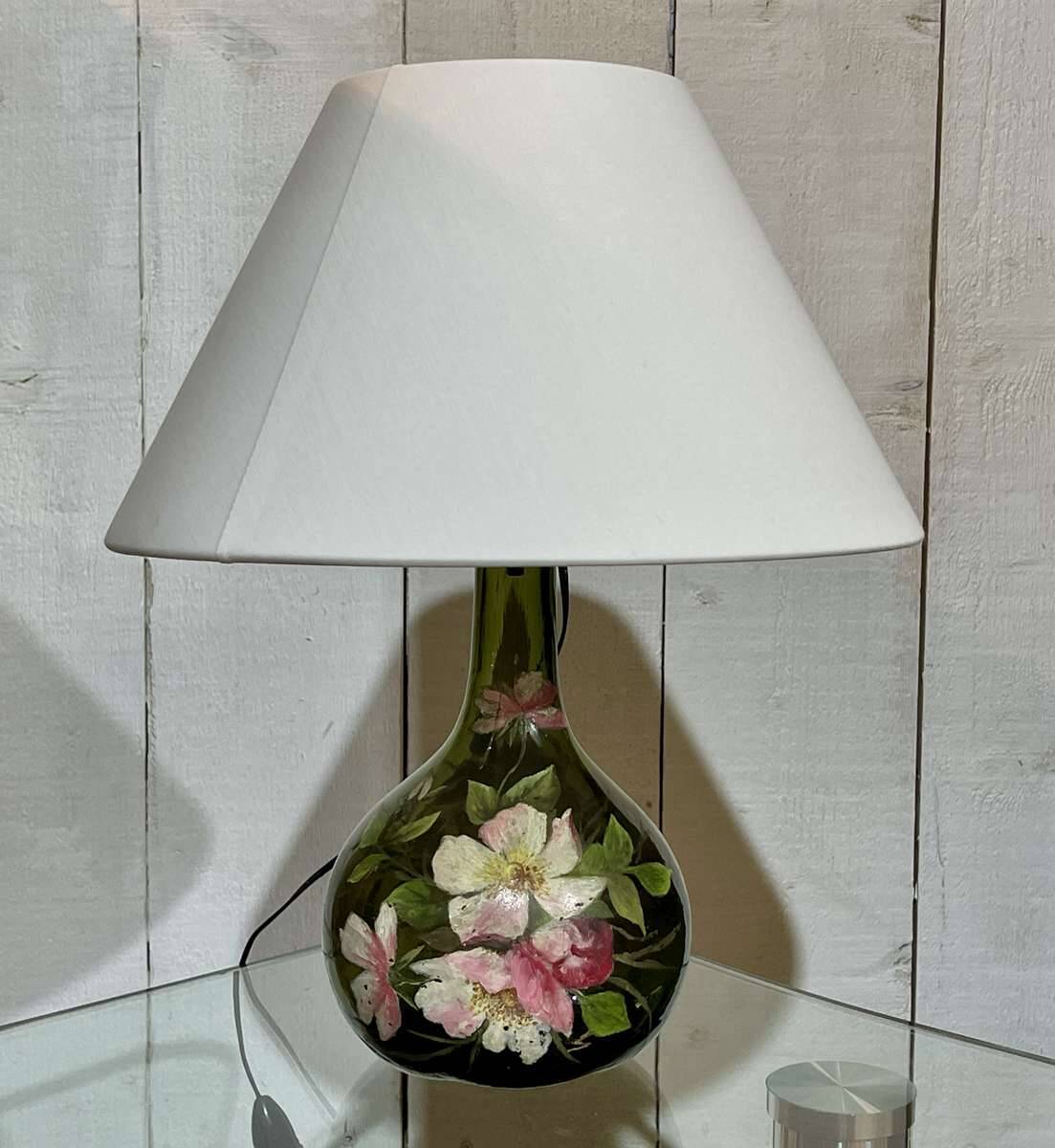 Blown glass lamp painted with a floral design, early 20th century.