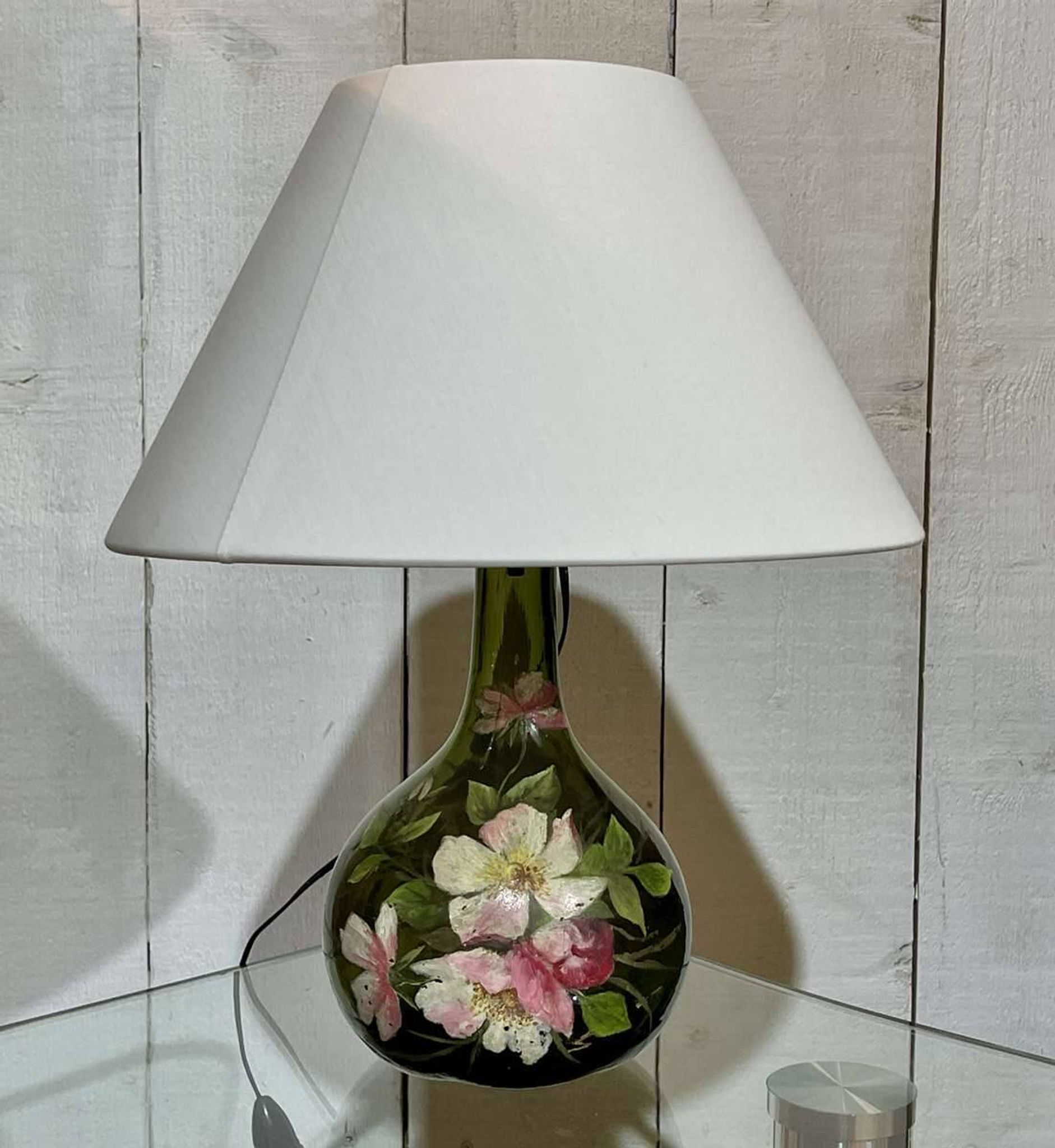 Blown glass lamp painted with a floral design, early 20th century.
