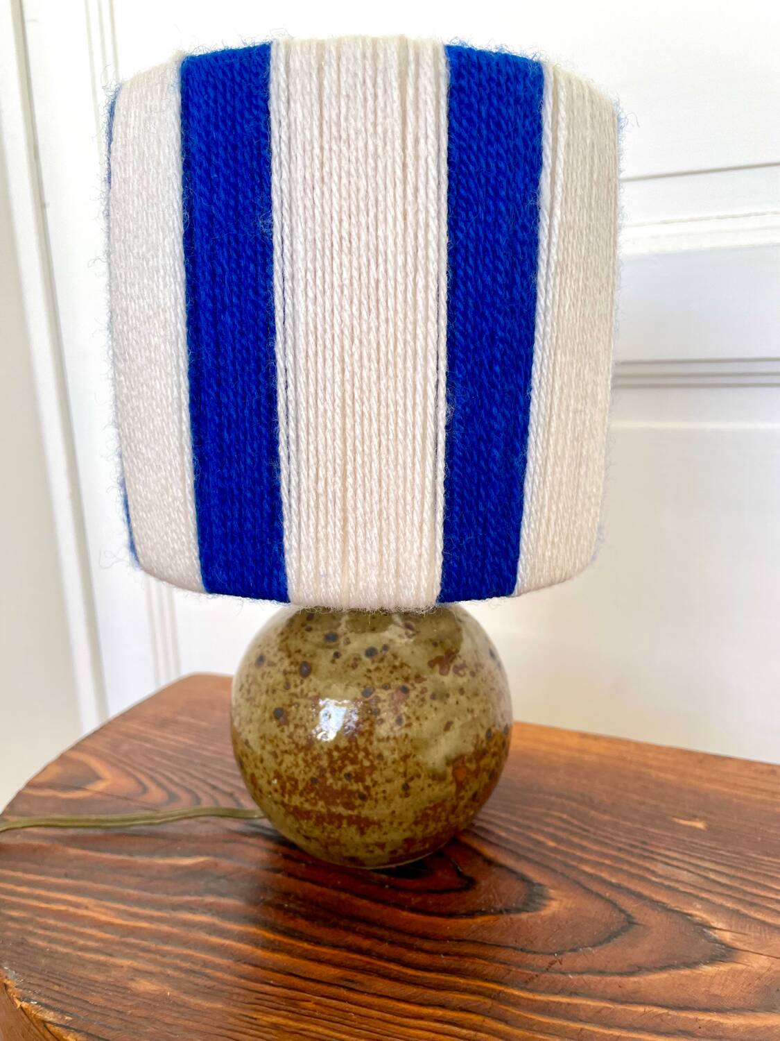 Vintage table lamp with pyrite sandstone base and striped wool lampshade