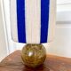 Vintage table lamp with pyrite sandstone base and striped wool lampshade