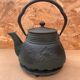 Old green cast iron Japanese teapot with flower decoration + vintage stand