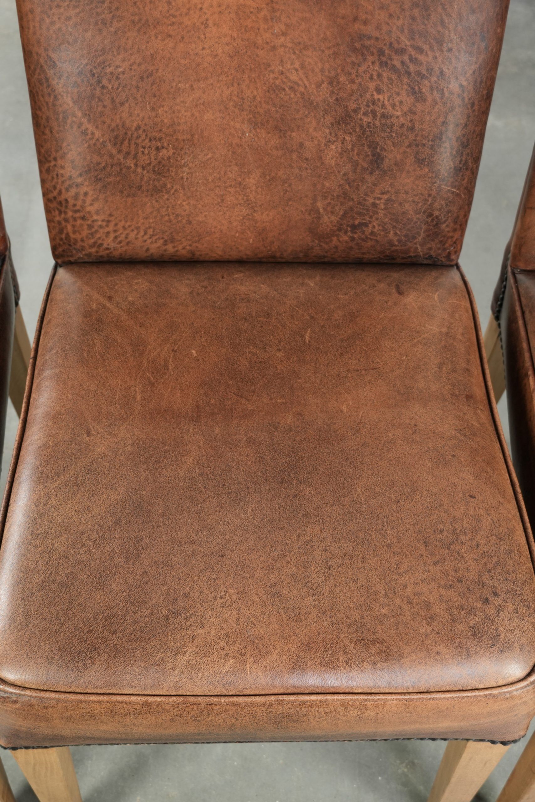 Vintage set of 4 dining chairs made of sheepskin leather with a high back