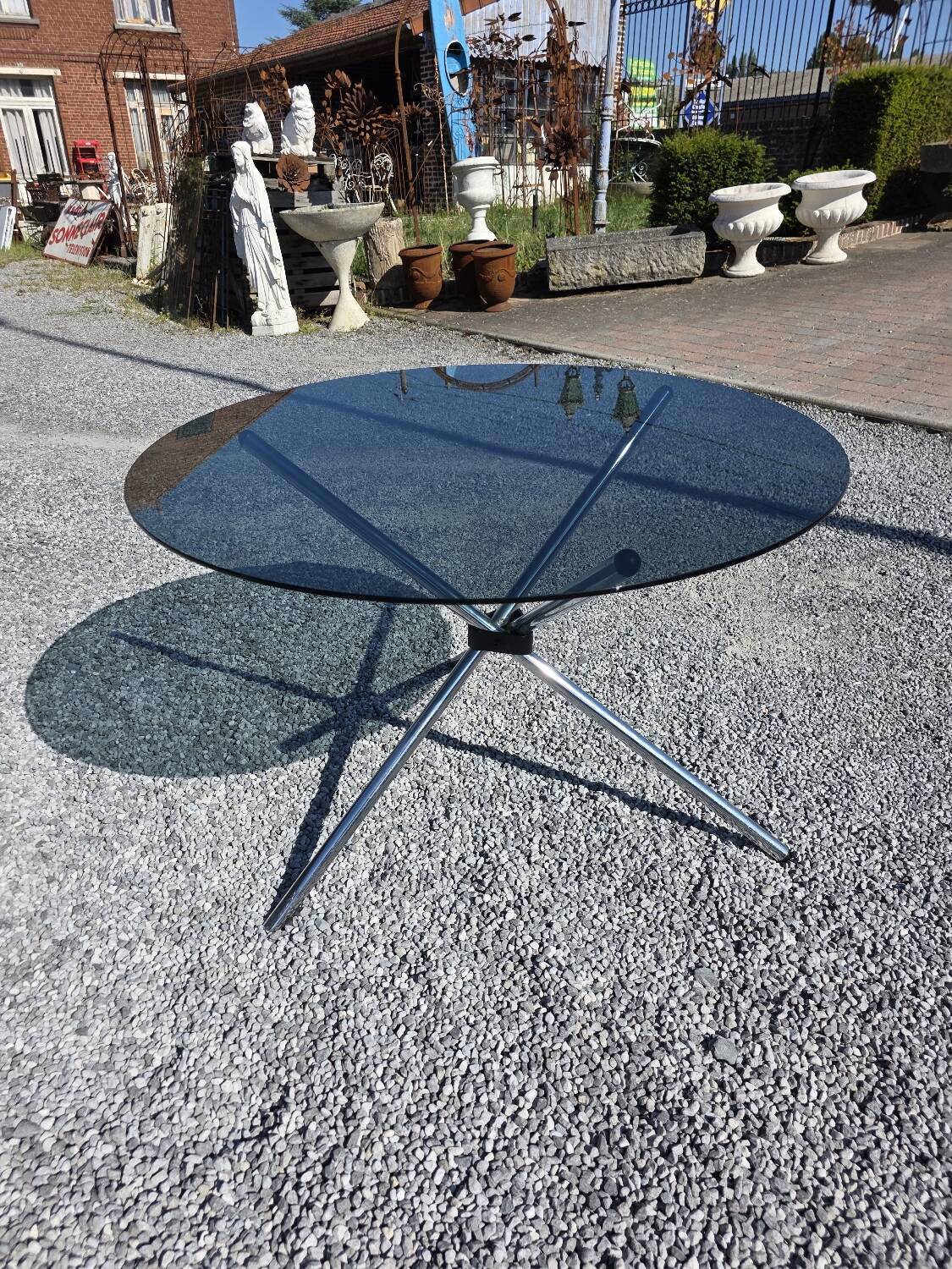 Round chrome metal table with smoked glass top from the 70s