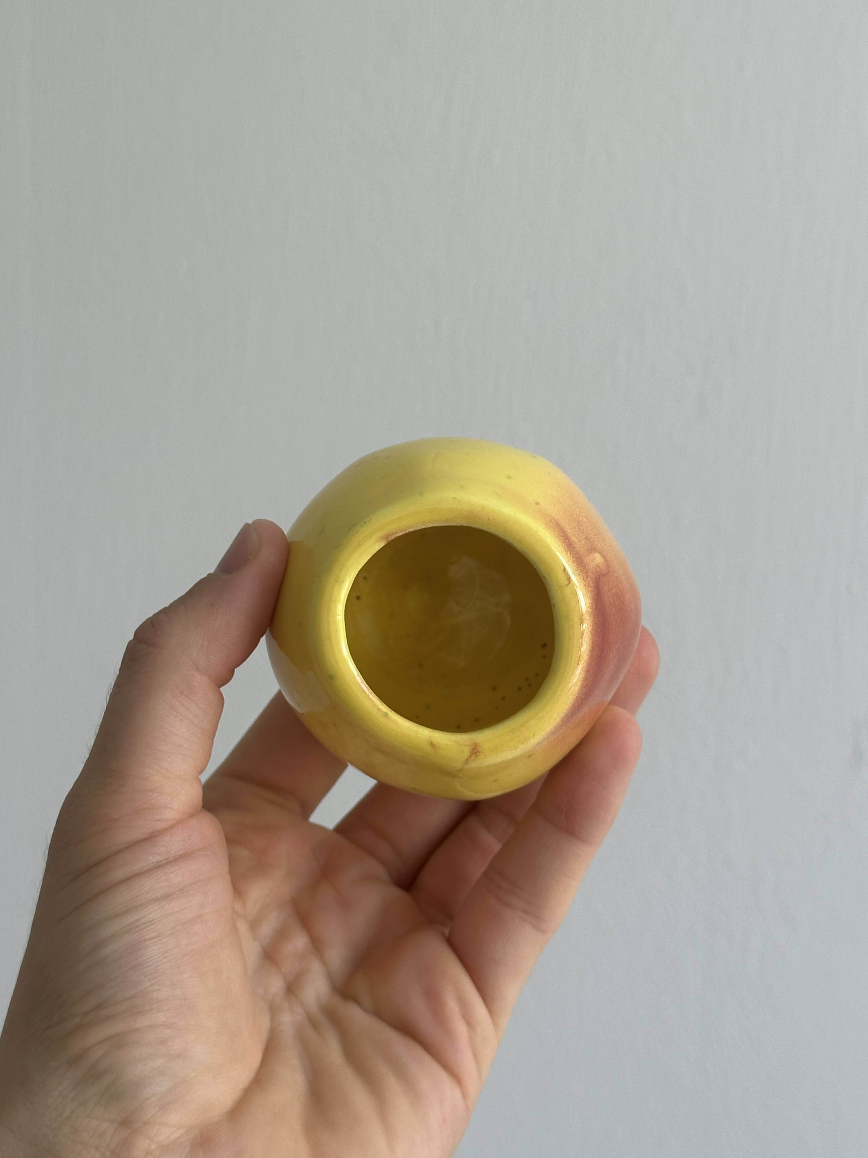 Yellow ceramic pear-shaped salt shaker