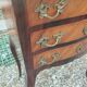 Antique marquetry commode with marble top in Louis XVI style.