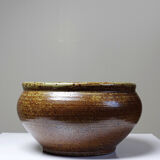 Vintage glazed stoneware bowl or planter in rustic wabi-sabi style.