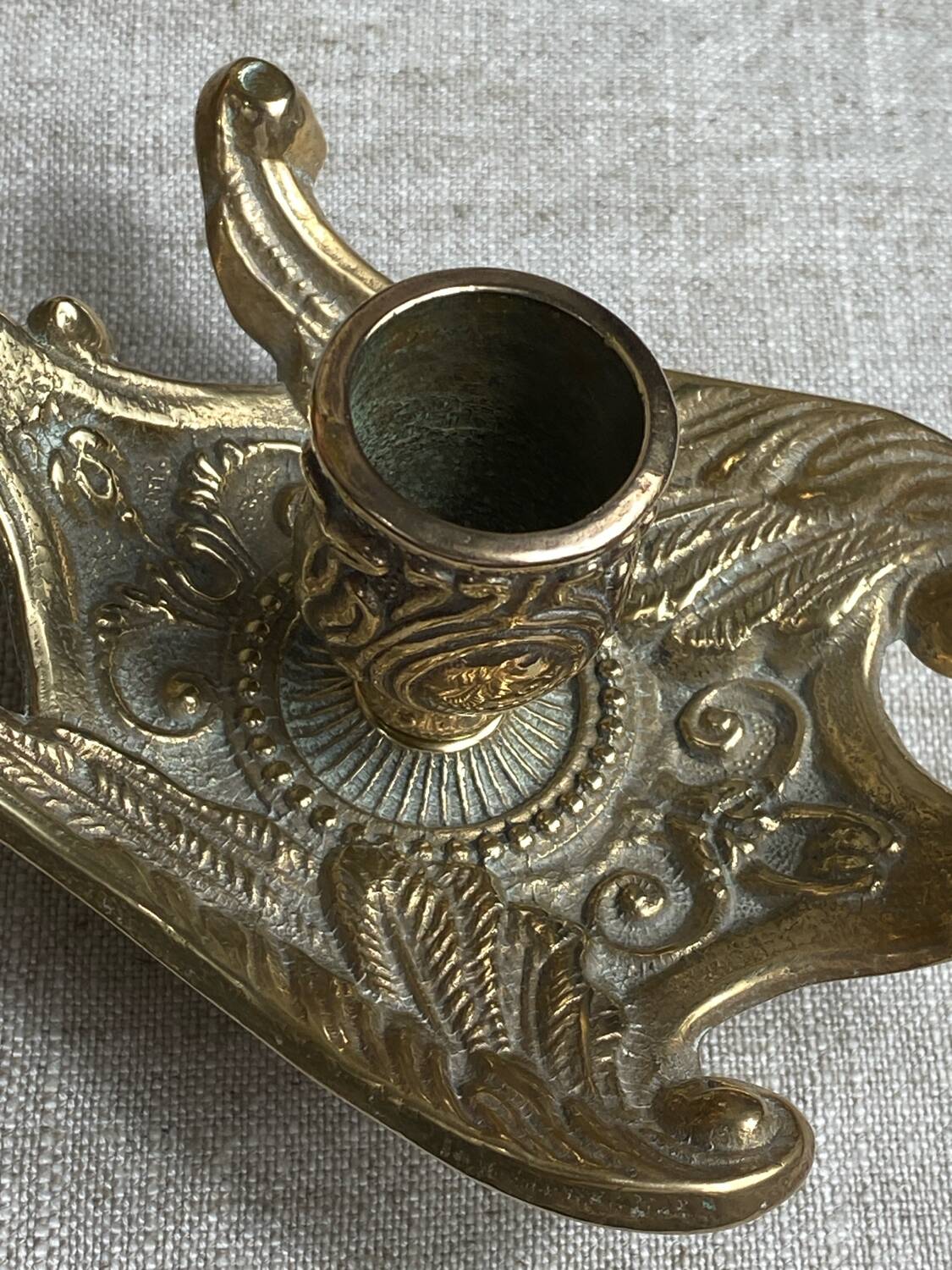 Bronze hand candlestick in the shape of a peacock