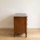 Antique curved wooden commode in classic style