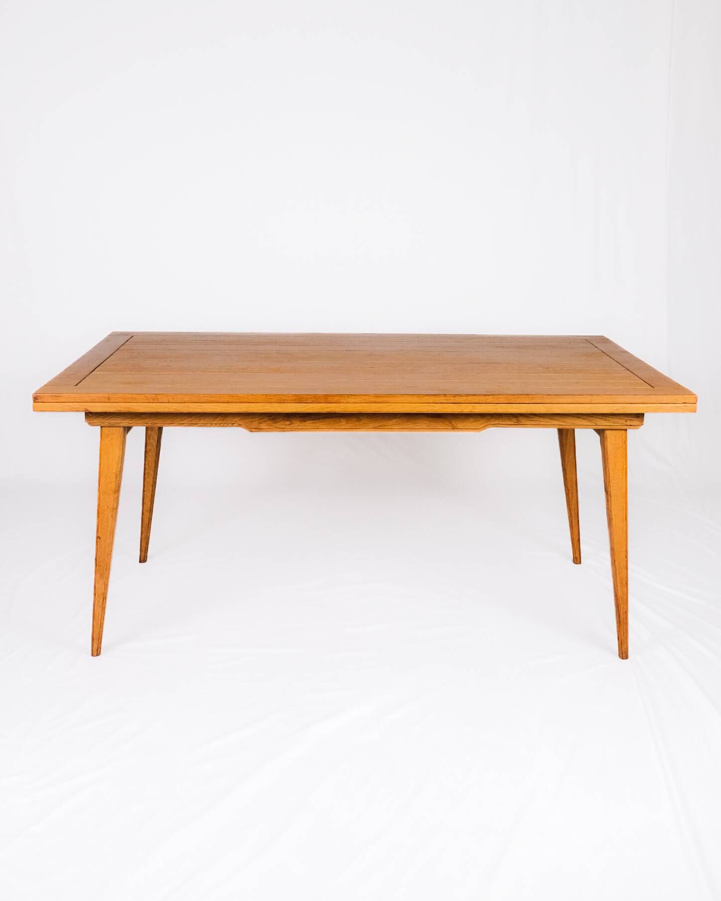Extendable oak table in the style of Guillerme and Chambron, France 1960s
