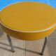 1 vintage round stool in yellow imitation leather