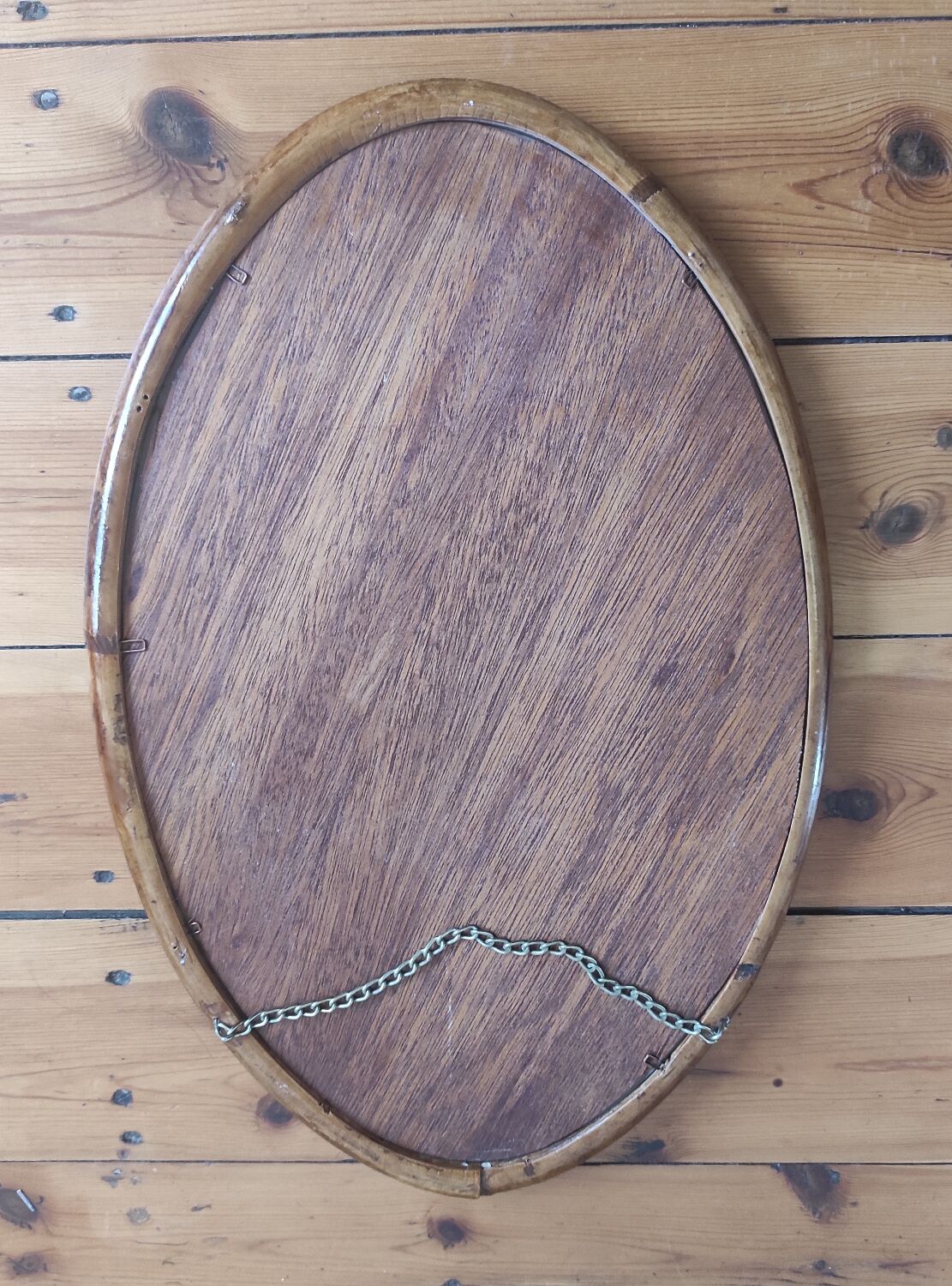 Vintage oval rattan mirror