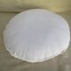Coussin blanc vintage rond