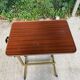 Foldable and adjustable serving trolley in wood and gold-plated steel