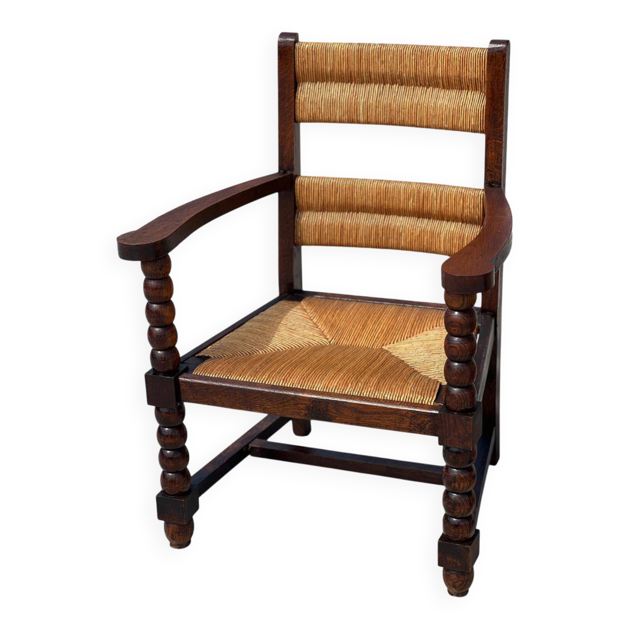 Armchair in stained oak and straw, French work from 1950.