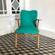 Fauteuil vintage bois et skaï vert