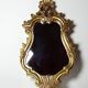 Vintage Rococo wall mirror, gold, Italy, circa 1950-1970, wood and gilded stucco.