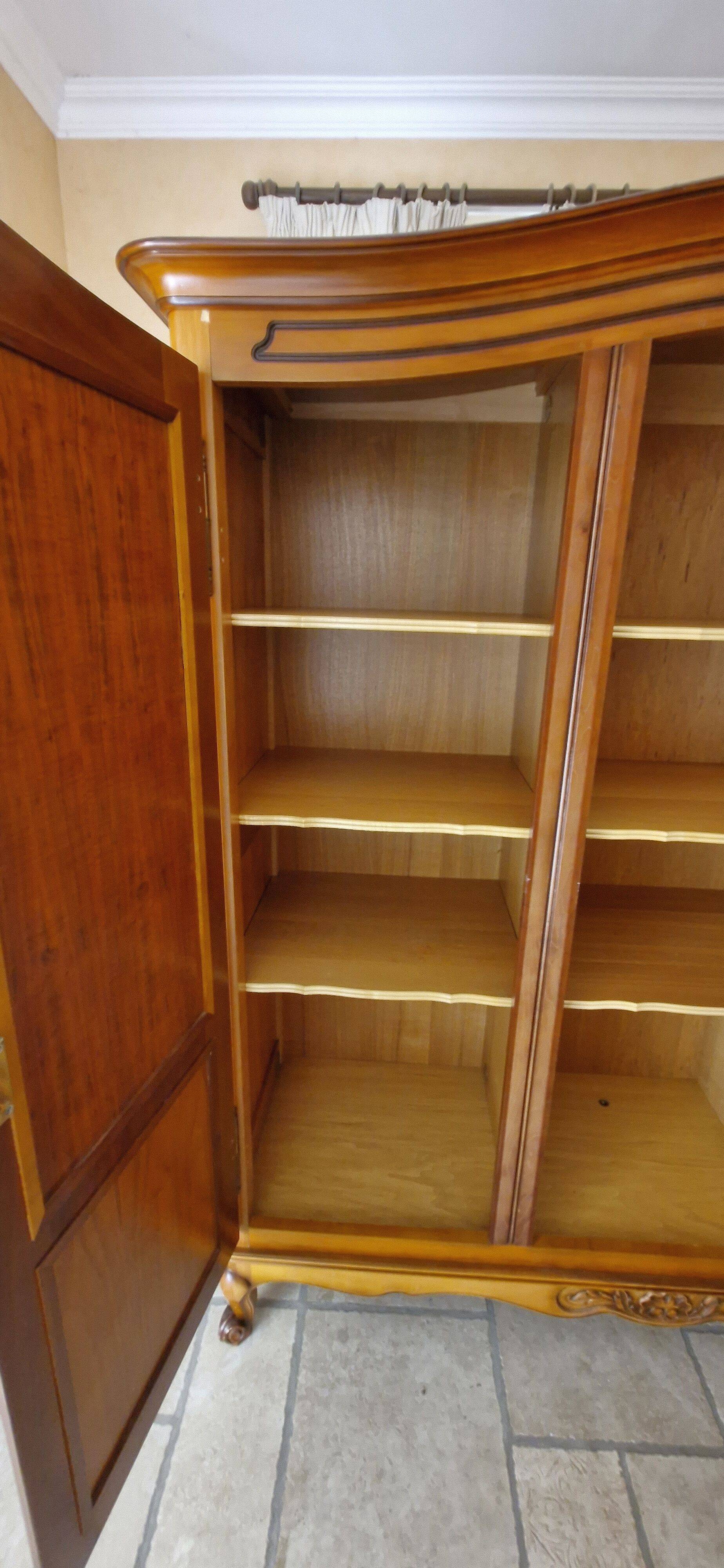 Wooden style wardrobe, 3 doors and 9 internal shelves.
