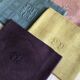Suite of four tinted antique napkins