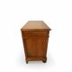 Antique walnut commode with bronze handles in the shape of a lion's mask,