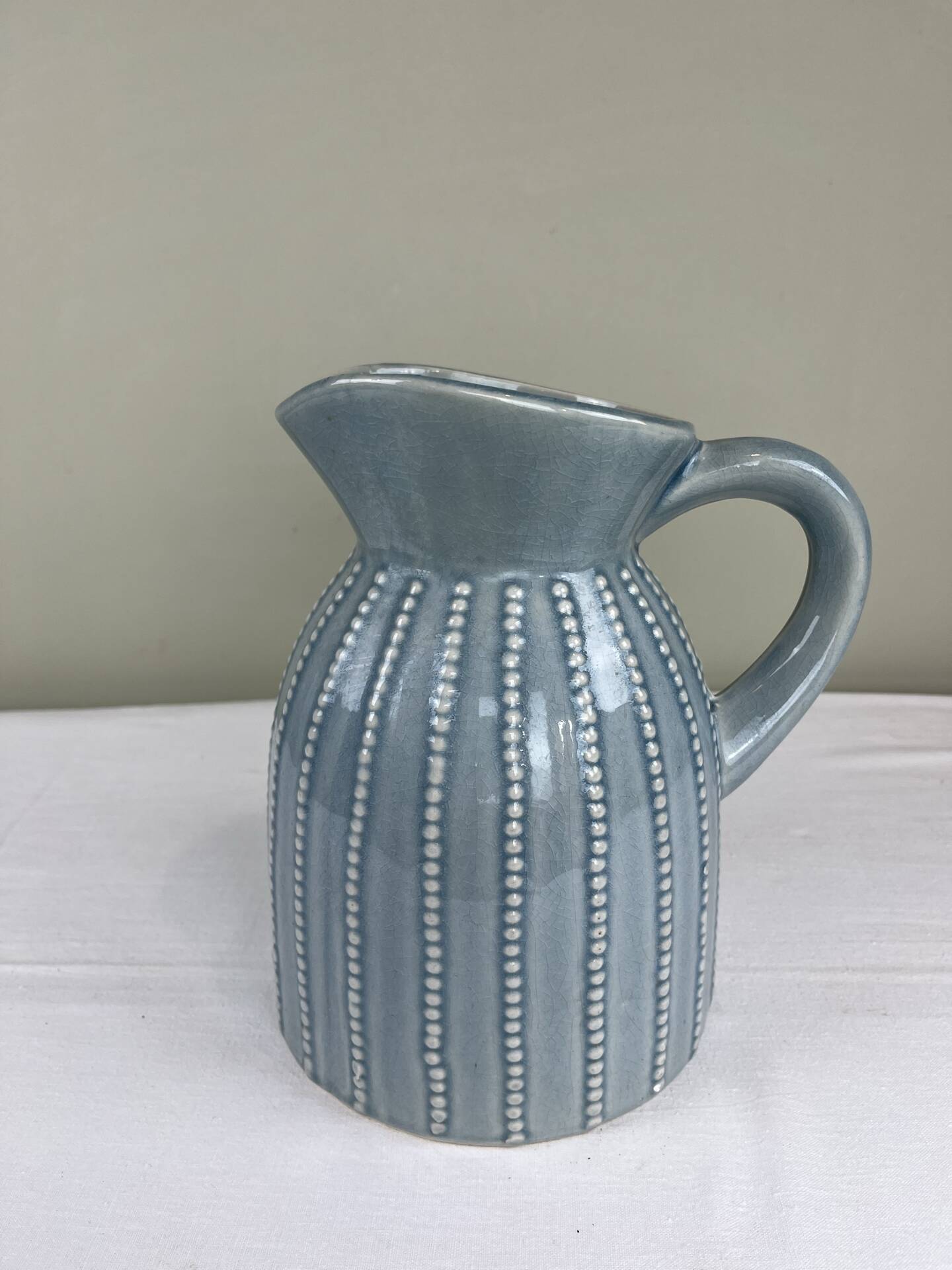 Large vintage pitcher in crackled celadon ceramic, beaded decoration.