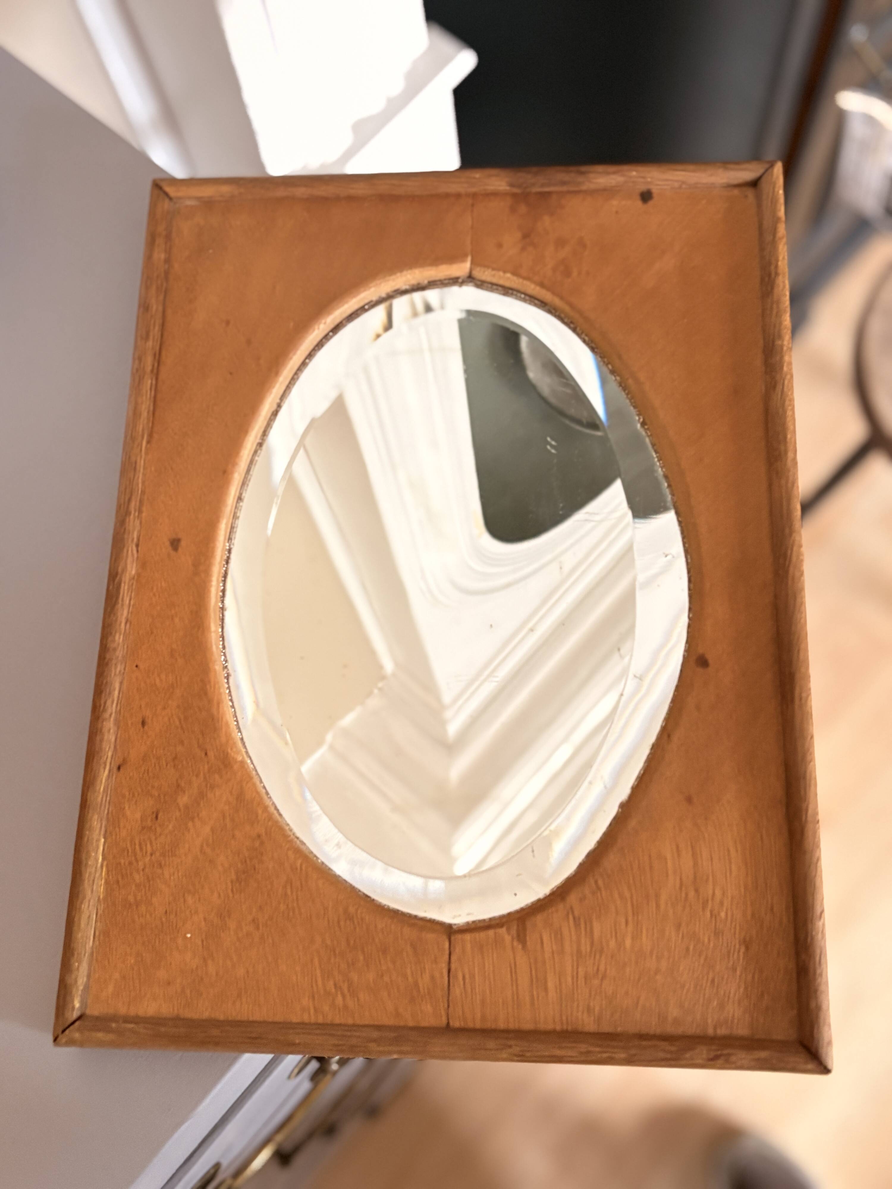 Bevelled oval mirror on oak frame
