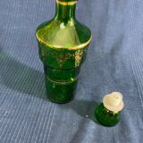 Green glass bottle and Louis style gilding