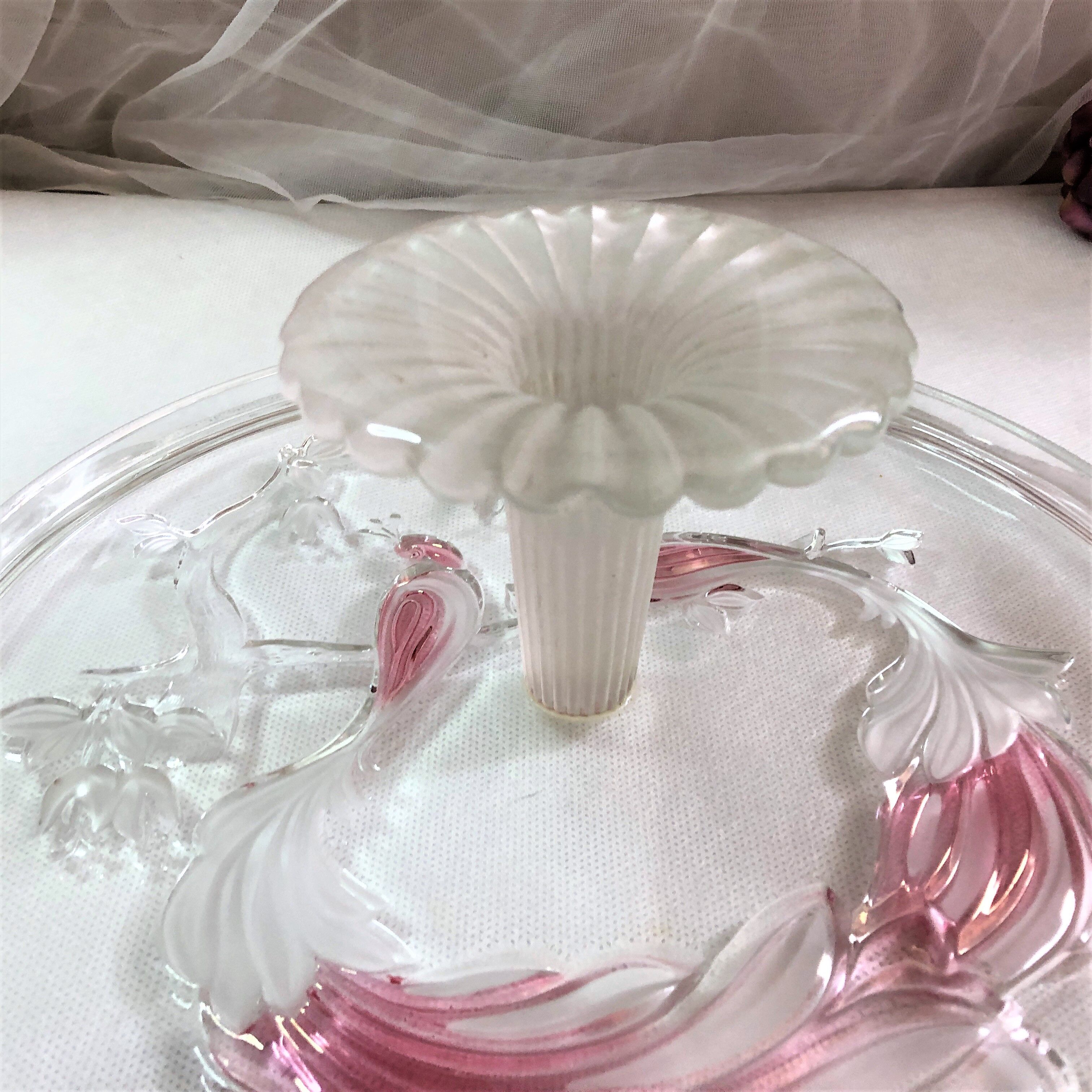 Large pie dish cakes on pedestal decorated with peacocks
