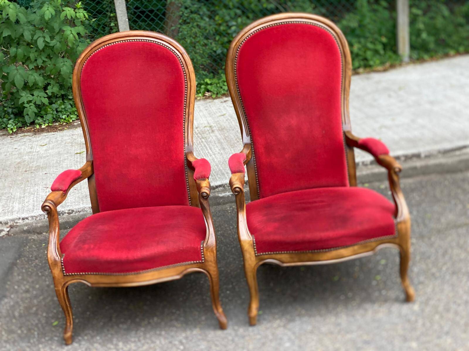 2 Louis Philippe cabriolet armchairs in burgundy velvet wood from the 19th century.