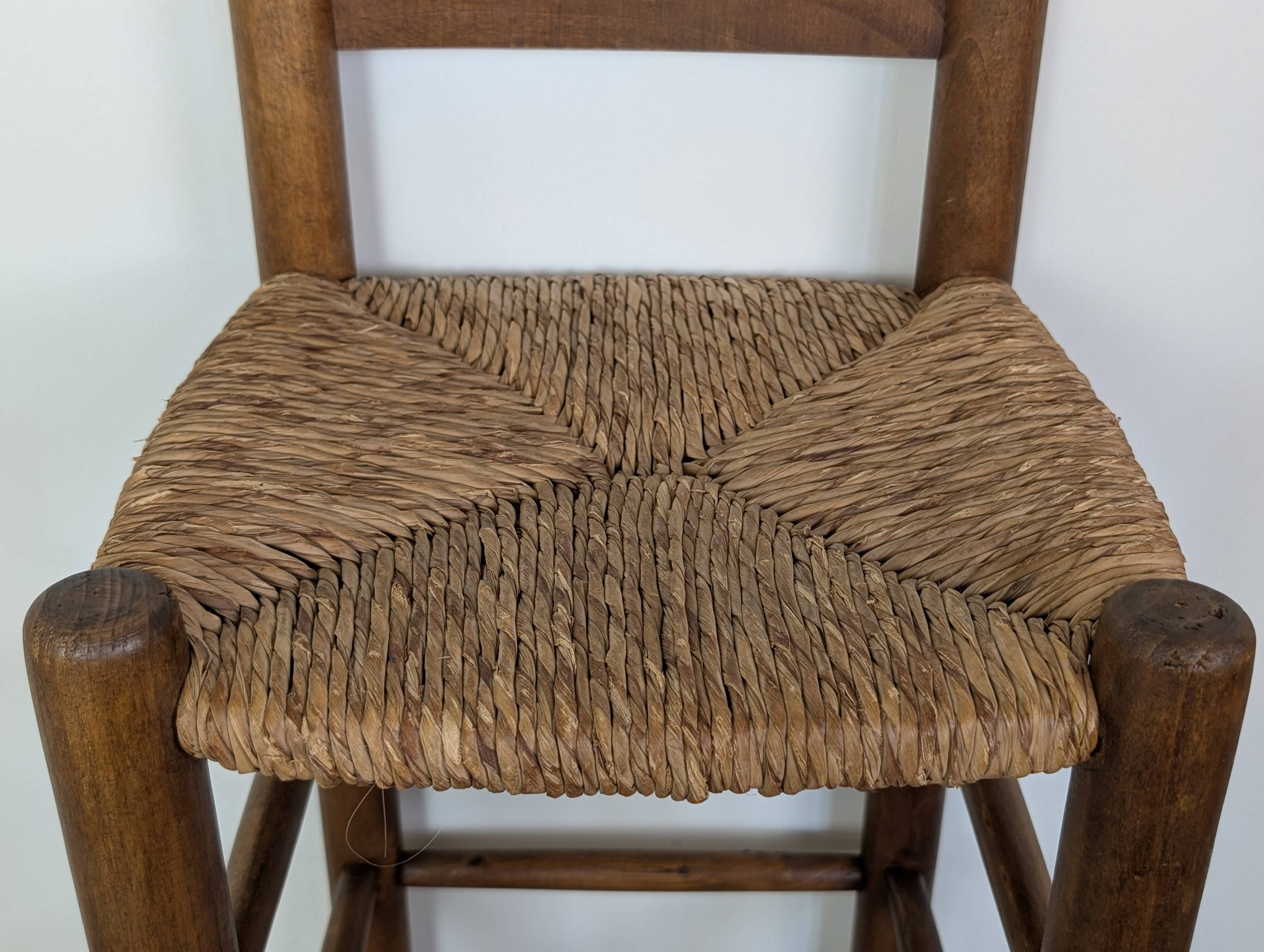 High wooden and straw stools