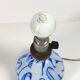 Antique table lamp in opaline glass with blue floral decoration.