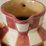 Old ceramic pitcher pattern checkerboard tiles