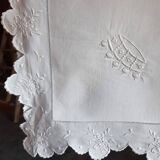 scalloped pillowcase decorated with a baron's crown