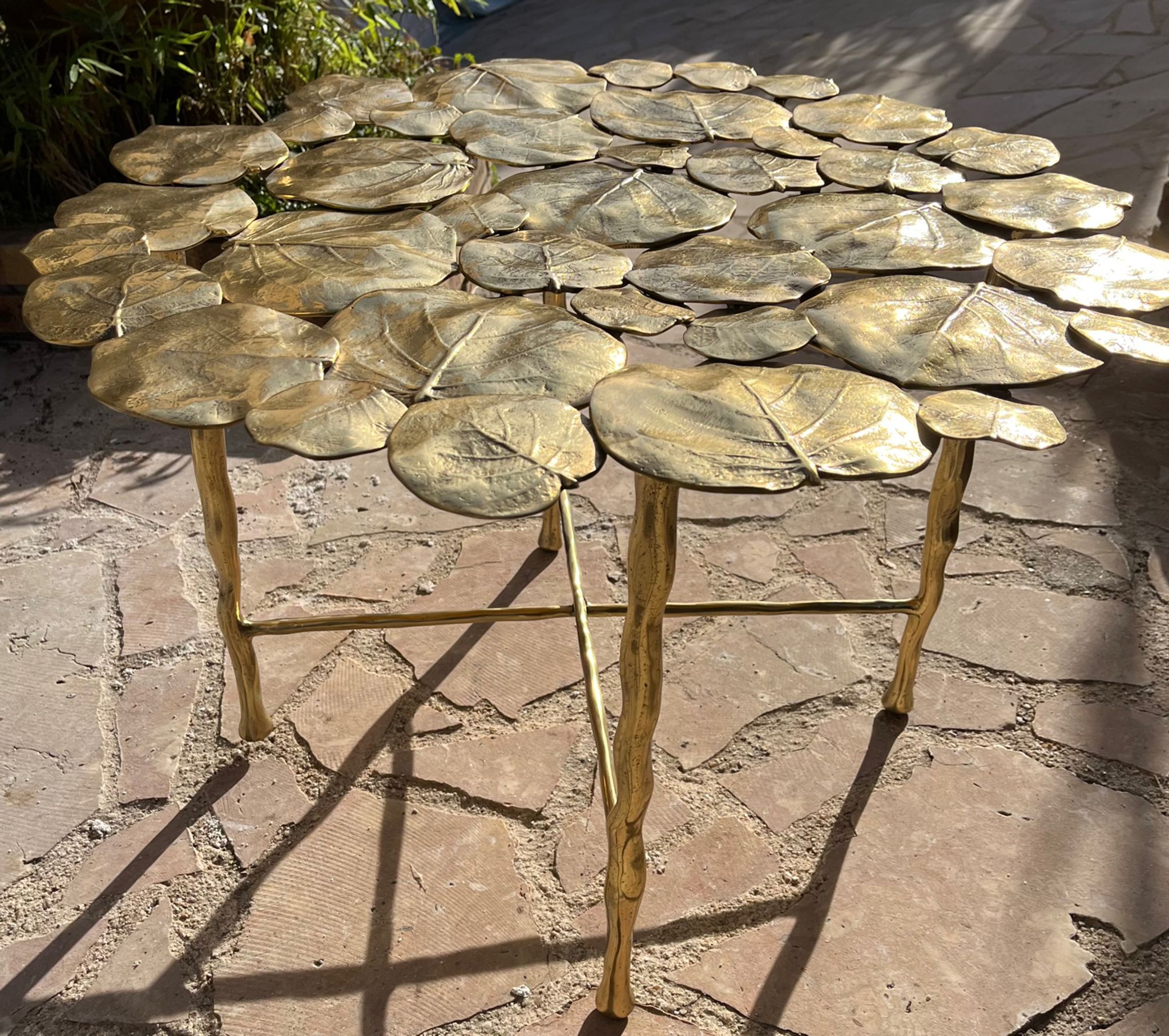 Carved brass coffee table with ginkgo decor